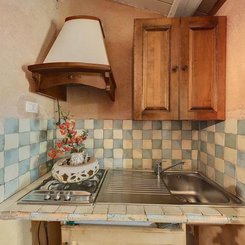camera_il_tramonto_tripla_cucina